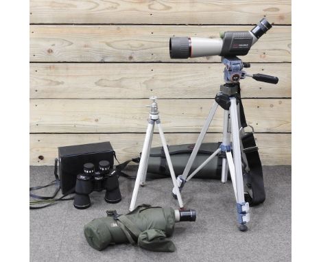 A Kowa Prominar spottingscope T5-613 telescope, on a tripod stand, together with another, T5-614, and a pair of binoculars