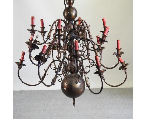 A Dutch style metal chandelier, 88cm diameter