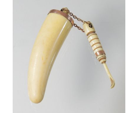 A 19th century 9 carat gold mounted ivory snuff box, 10cm high, with spoon, on a gilt chain