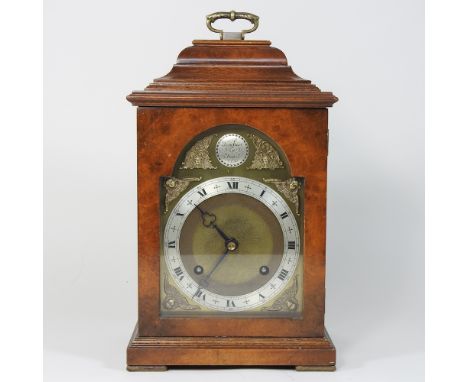 A reproduction walnut cased bracket clock, with an eight day Imperial movement, 34cm high