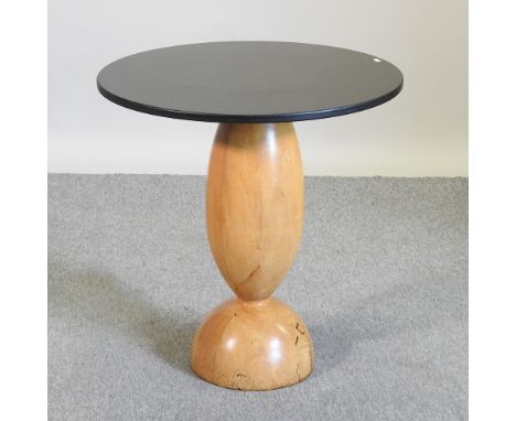 An Art Deco style occasional table, with a slate top on a light beech base, 70cm diameter