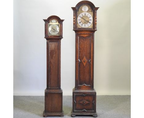 An early 20th century oak cased longcase clock with Westminster chimes, 188cm high, together with another smaller (2)