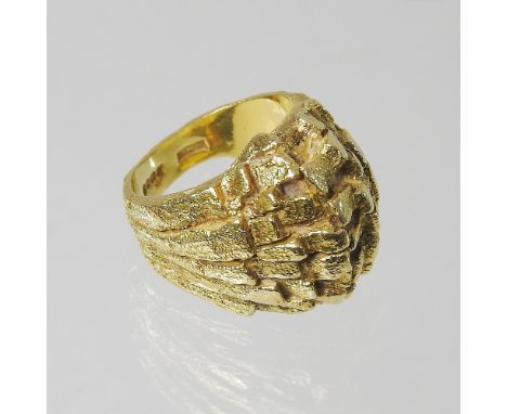 A large 18 carat gold ring, of textured design, size M, 10.2g gross