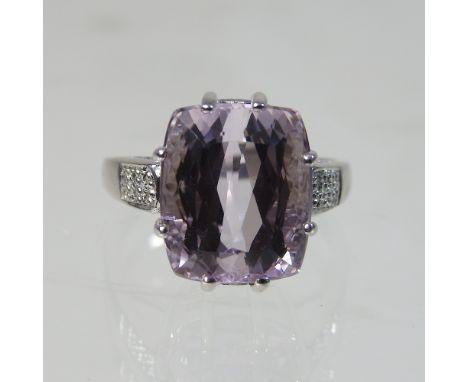 A 9 carat gold pink Brazilian kunzite and diamond ring, with gem set shoulders, size R, 7.4g, boxed