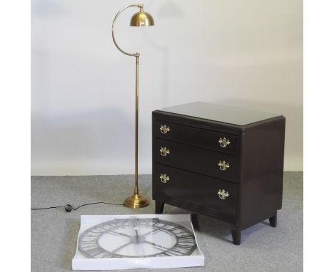A brown painted chest of drawers, 76cm, together with a wall clock and a brass standard lamp (3)