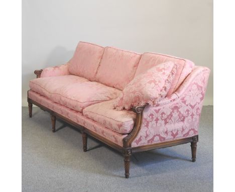 A 20th century pink upholstered sofa, of 18th century style, on turned legs, 223cm