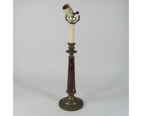 A red marble table lamp, 45cm high