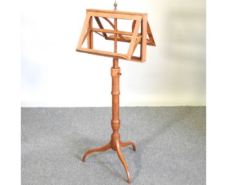 A light oak duet stand, on a tripod base, 131cm high