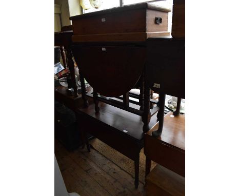 A 19th century mahogany Pembroke table on turned column legs, together with a 19th century oak drop leaf gateleg dining table