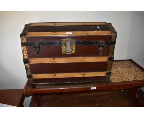 Two vintage metal bound dome topped travelling trunks (2).