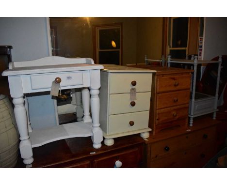 A vintage pine side table with raised back and single drawer, width 60cm, two pine bedside chests of three drawers and a pain