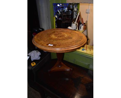 A reproduction inlaid yew, oak and fruitwood coffee table on fluted column terminating on a triangular plinth base, diameter 