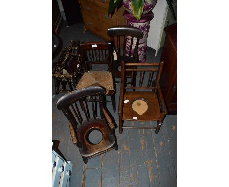 Three 19th century child's commode chairs and a rush seated child's chair (4)