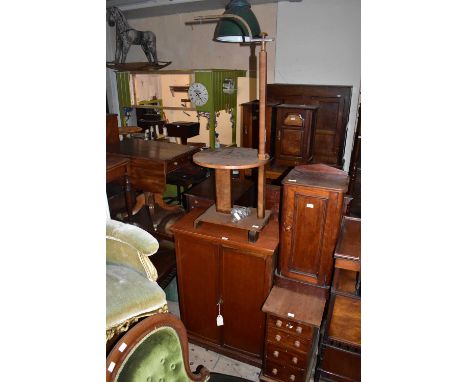 A mahogany twin door cupboard on plinth base, height 110cm, width 77cm, and an Art Deco standard lamp/table (2).