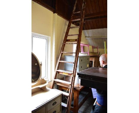 ENWRIGHT LADDERS, LIVERPOOL; a pair of vintage folding stepladders, height approx. 370cm.