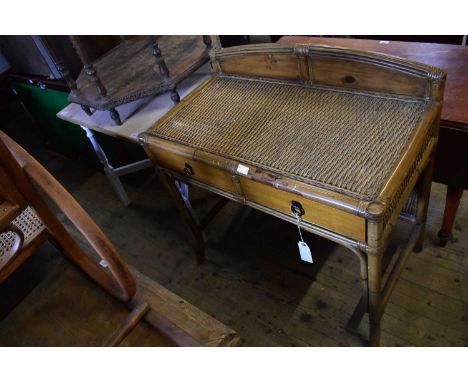 A painted pine table, height 73cm, together with a pine and wicker bamboo effect side table with two drawers (2).