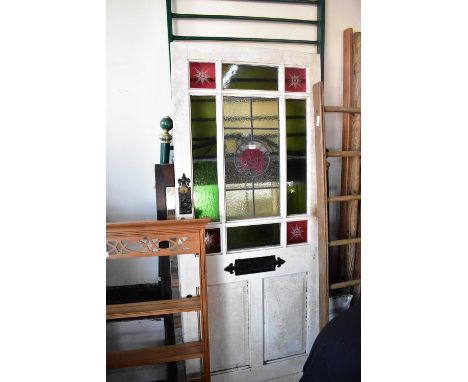 A vintage door with leaded glazed and stained glass panels, height 196cm, width 83cm.