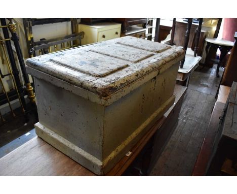 An old painted pine tool chest with panelled top and plinth base, width 96cm.