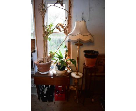 An early 20th century drop-leaf Pembroke table, cream painted standard lamp, inlaid mahogany jardinière stand, two planters a