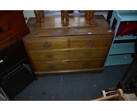 A pine chest of two short over two long drawers on plinth base, width 110cm, depth 50cm, height 80cm.