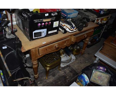 A 19th century pine two drawer farmhouse table on turned column legs, length 140cm, height 80cm.