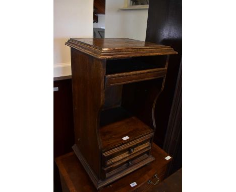 A painted pine pot cupboard on plinth base, together with an oak effect bedside table (2).