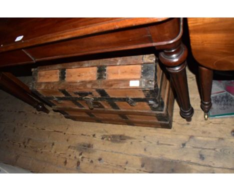 A metal bound pine dome top travel trunk, width 73cm, and a metal tray containing various printing blocks.