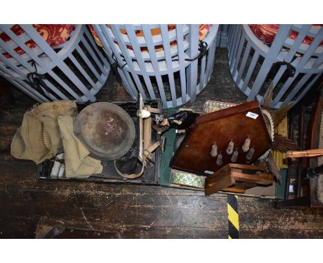 An assortment of collectors' items and militaria including a shell cabinet, a table lamp modelled as a Geisha girl, skittle g