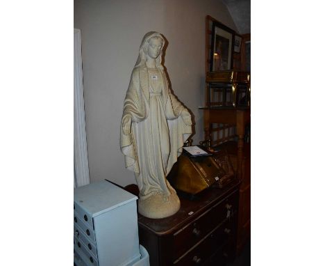 A large composite model of The Virgin Mary standing on the Garden of Eden serpent, depicting the crushing of evil as foretold
