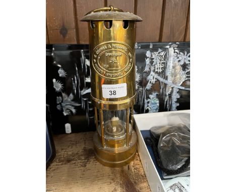 A repro brass miner's lamp 