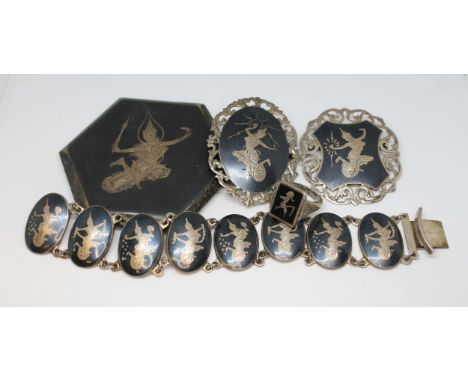 A suite of Siam jewellery comprising a compact, two brooches and ring and a bracelet, all pieces marked 'Sterling' or 'Silver
