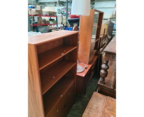 A mid 20th century teak sideboard, a teak bookcase, a chrome standard lamp and a mid 20th century bookcase with sliding glass