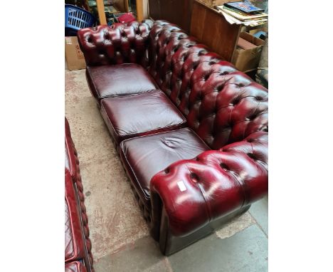 An oxblood red leather Chesterfield 3 seater sofa. 