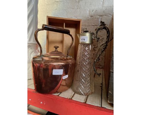 A copper kettle and a silver plated cut glass claret jug. 