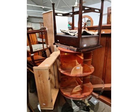 A pine spice rack, a revolving bookcase and an Edwardian piano stool. 