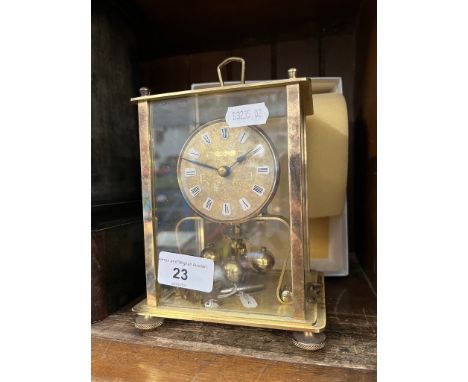 A brass revolving ball carriage clock 