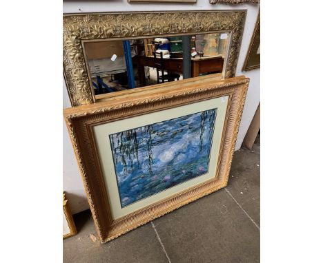 A print "Water lilies", after Claude Monet, 62.5cm by 50cm, framed and glazed together with a gilt framed mirror, 90cm by 115