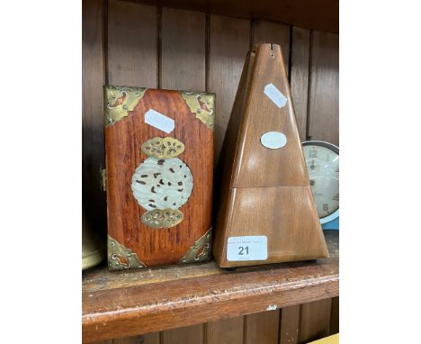A metronome by Paquet and a small brass bound trinket box with inlaid lid 