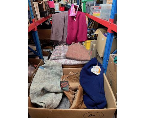 A box of 1950s, 1960s and 1970s vintage women's skirts. 