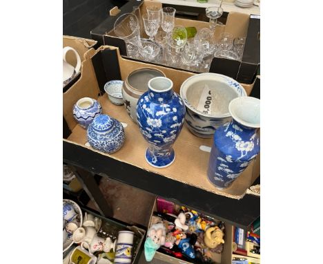 Assorted mainly Chinese porcelain comprising two blue and white prunus vases bearing Kangxi marks, a ginger jar, a rice bowl,