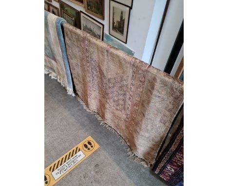 A vintage Eastern silk carpet with hanging rail, approx 180 cm by 118 cm 