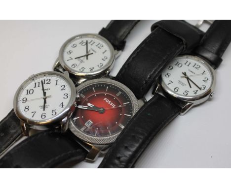 Three Timex Indiglo watches and a Fossil. 