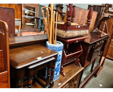 An oak nest of tables, a Chinese ceramic stick stand with sticks, a mahogany stool and a magazine rack table. 