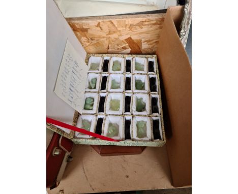 A collection of 12 Chinese carved jade animals, each approx. 3cm height, boxed and with display case. 