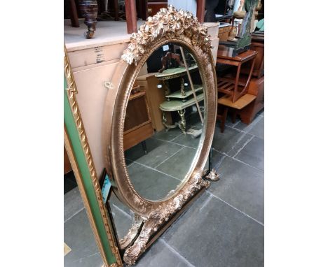 A large gilt framed overmantle mirror (102cm x 145cm) and another Art Deco style mirror. 