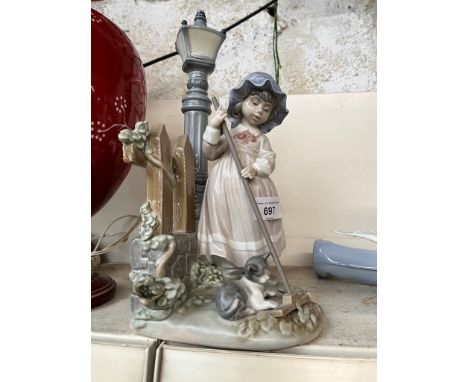 Lladro figure of a girl by a street lamp. Ht.34cm 