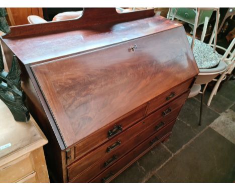 A George III mahogany bureau standing on ogee bracket feet, some later elements. Condition- some general wear, handles have b