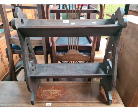 An early 20th century carved oak book trough. 