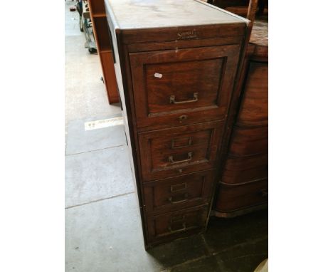 An early 20th century oak filing cabinet by Simpoles, Manchester, height 130.5cm. Condition- one of the side panels is loose,