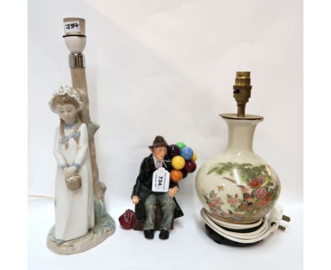 A Royal Doulton figure The Balloon Man, a Nao lamp base and another table lamp Condition Report: Available upon request